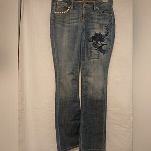 Hippie Blue Denim Jean With Flower Embroidery And Studded Pocket.